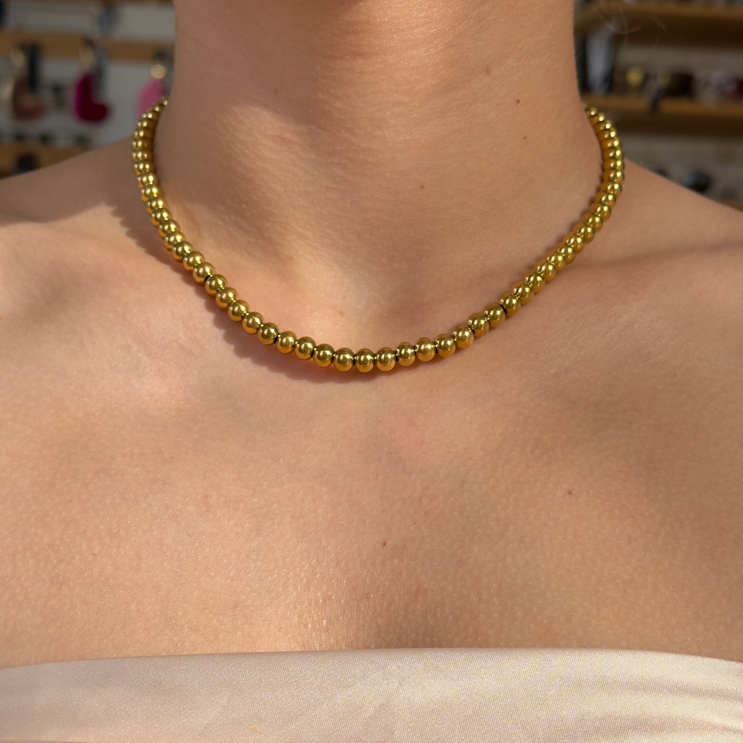 COLLAR BALINES DORADO