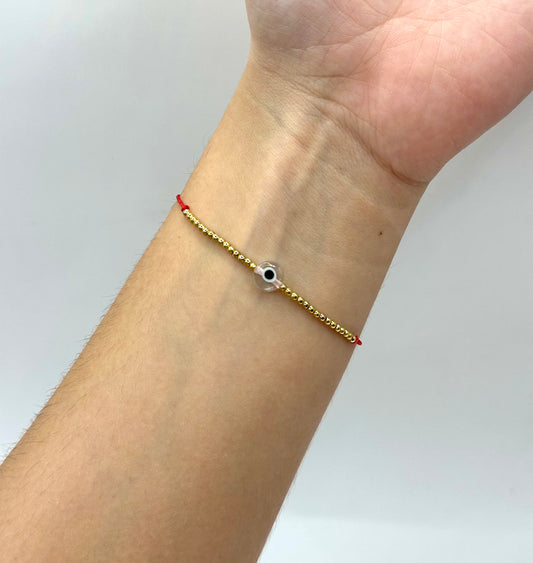 PULSERA OJO CON CHAQUIRITAS DORADAS